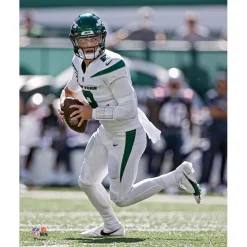 Photos|Prints & Artwork^New York Jets Zach Wilson Unsigned White Jersey Scrambling Vertical Photograph